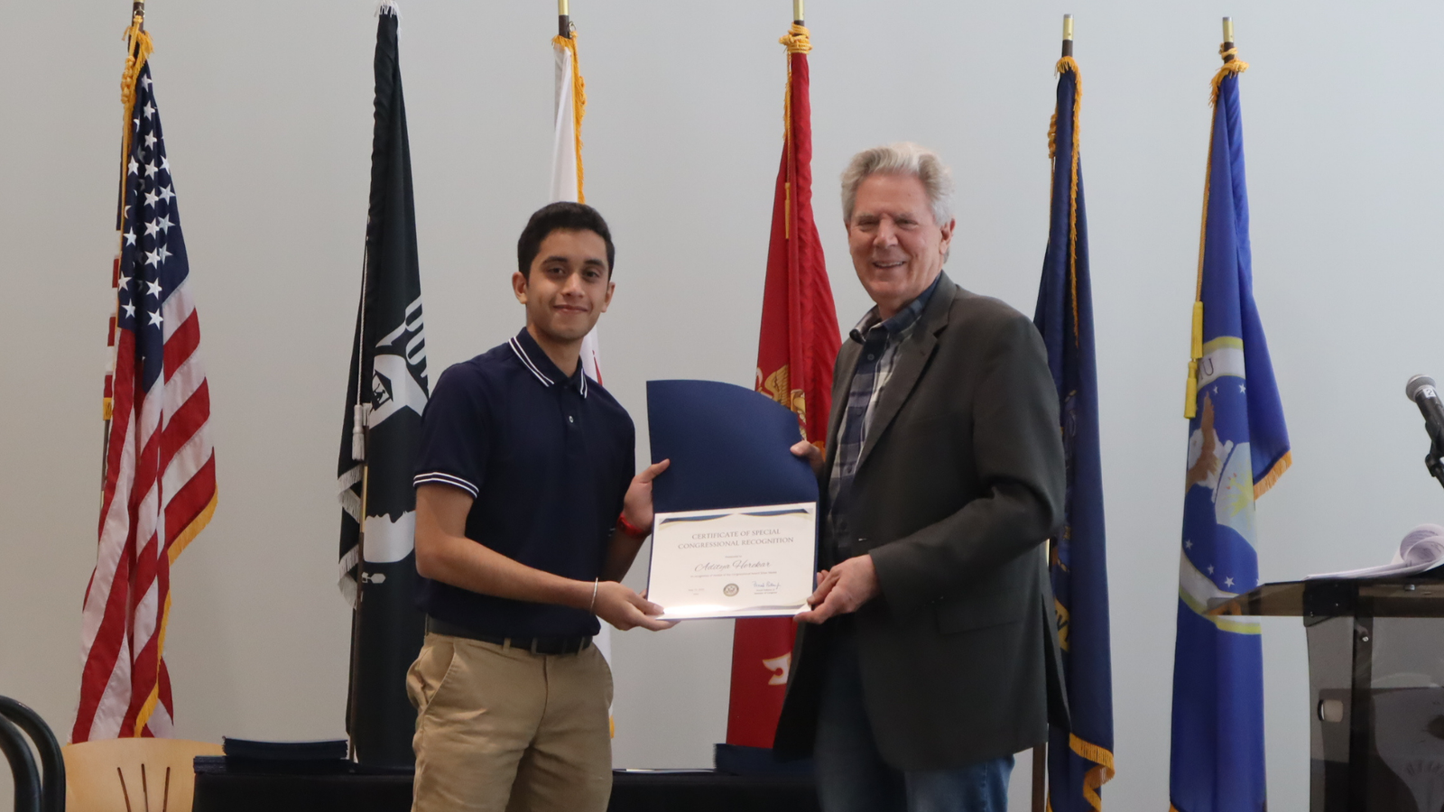 Aditya Herekar receiving a Certificate of Special Congressional Recognition from Congressman Frank Pallone, Jr.