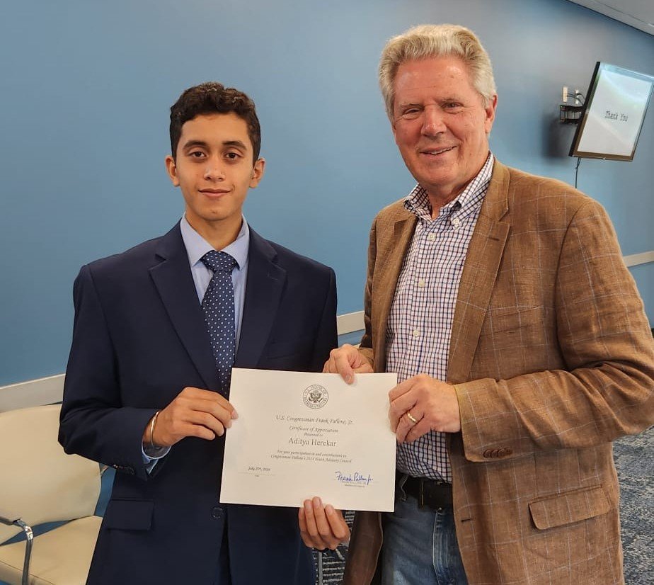Aditya Herekar receiving a certificate of appreciation from Congressman Frank Pallone, Jr.